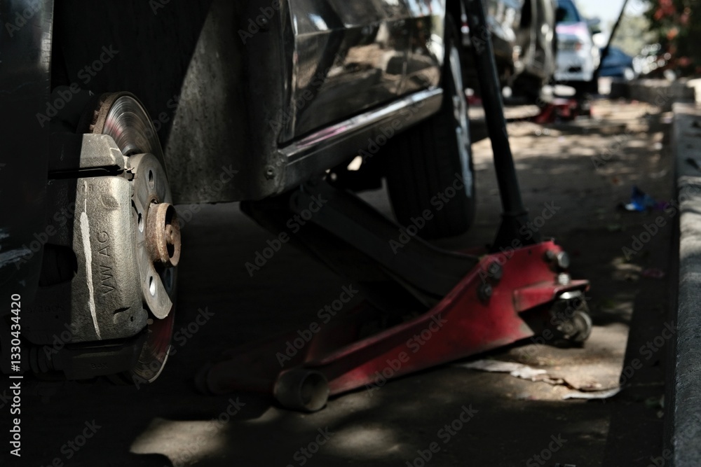 View of the process of alignment of the wheels of a car View of the process of alignment of the wheels of a car