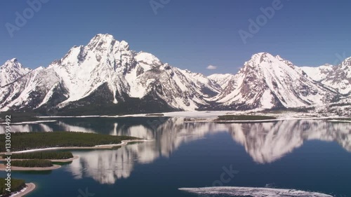 Aerial Cinematic Drone Shot of Grand Tetons Wyoming with snow capped mountain