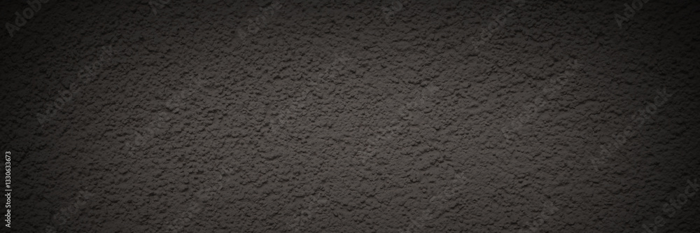 Texture of the old wall. Rough grungy surface of painted plastered concrete wall with spots, cracks, noise and grain. Dark wide panoramic background for design. Shaded vintage texture with vignette.