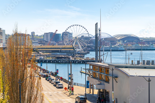 View of the Seattle Waterfront along the Puget Sound with downtown district skyscrapers, the Pike Place Market district, and Great Wheel in view from the harbor in Seattle Washington, USA.	