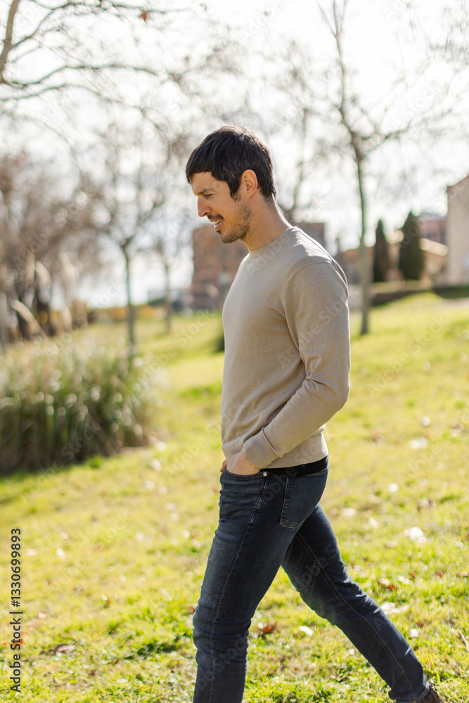 A middle-aged Caucasian man walks through a sunlit park, with a peaceful natural expression. Relaxed posture, calm and carefree moment. Full-body shot, vertical, blurred background with trees grass A middle-aged Caucasian man walks through a sunlit park, with a peaceful natural expression. Relaxed posture, calm and carefree moment. Full-body shot, vertical, blurred background with trees grass