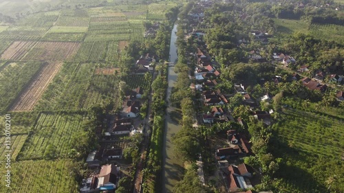 Panoramic view of the village located under the mountain slopes and there are rivers flowing