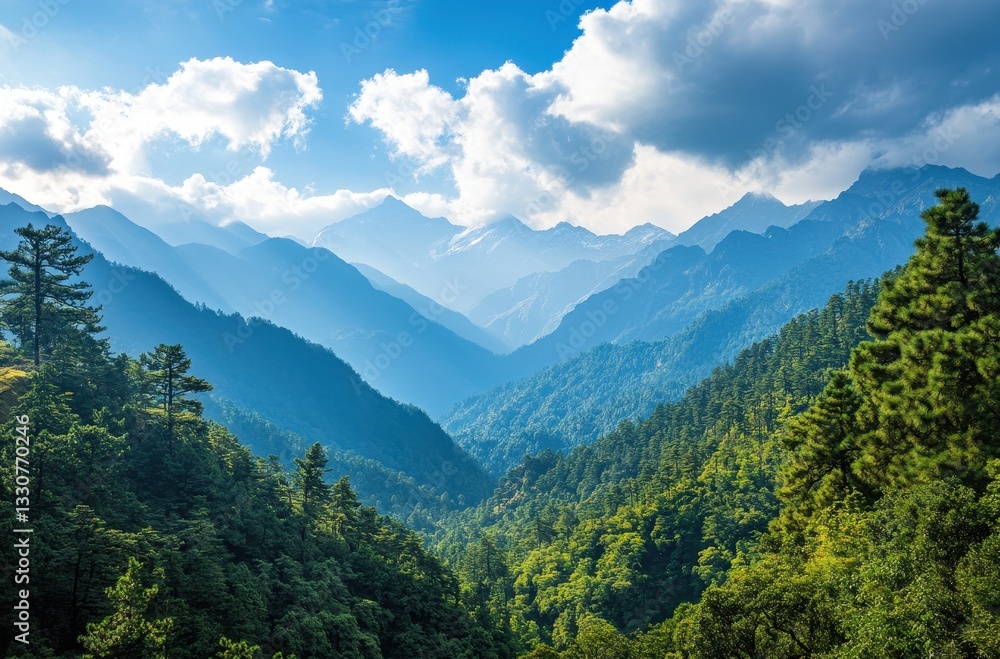 Fototapeta premium Serene Mountain Landscape with Majestic Peaks, Lush Green Valleys, and Dynamic Cloud Patterns under Clear Blue Sky in a Tranquil Natural Setting