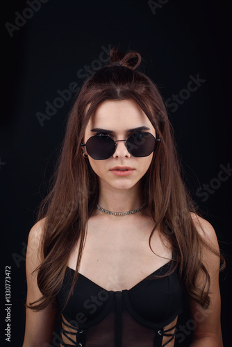 Wallpaper Mural Young beautiful glamour girl posing in semi-transparent black dress and sunglasses on black background Torontodigital.ca