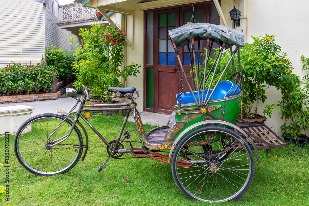 Rickshaw outside a house in Phuket Town, Thailand
