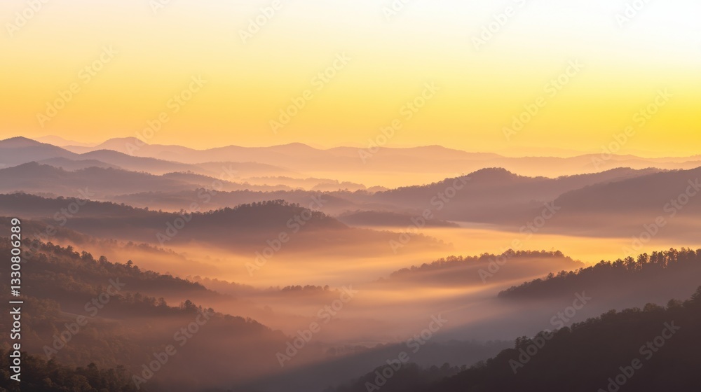 Layers of mountainous hills covered in morning mist at dawn Layers of mountainous hills covered in morning mist at dawn