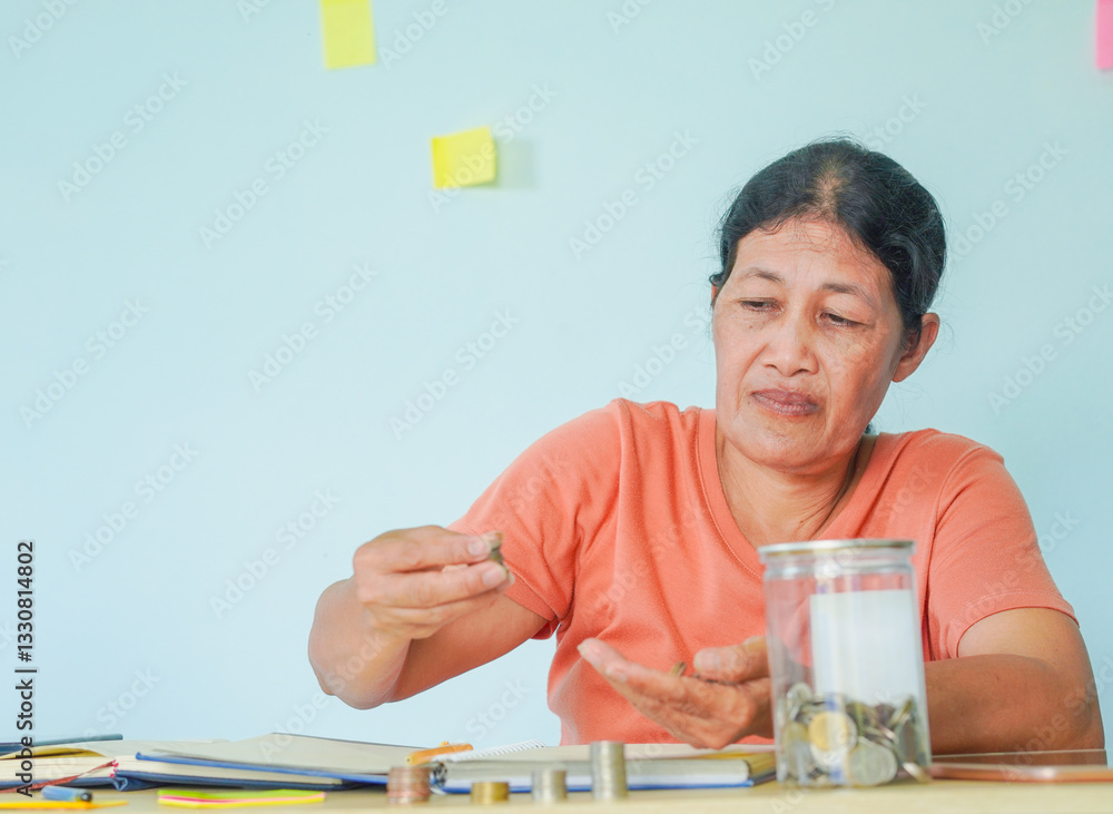 Business People. Senior Asian businesswoman counting money. Plan for retirement. Financial planning. People saving coins. Startup business. Remote work. Savings, Thai baht coins, Thai baht