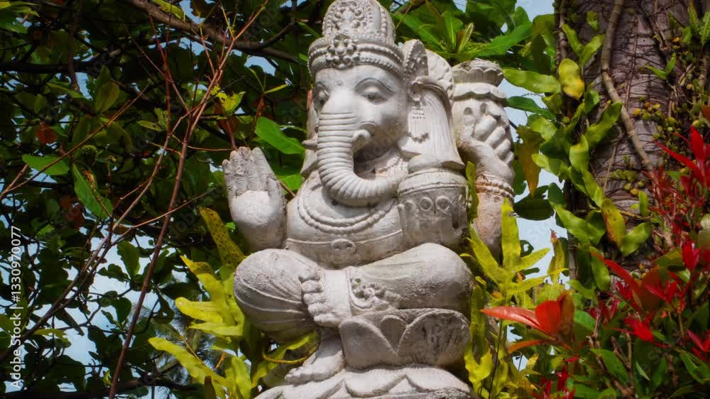 An old stone statue of Ganesha covered with moss. An old stone statue of Ganesha covered with moss.