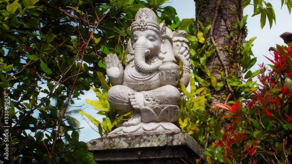 An old stone statue of Ganesha covered with moss. An old stone statue of Ganesha covered with moss.