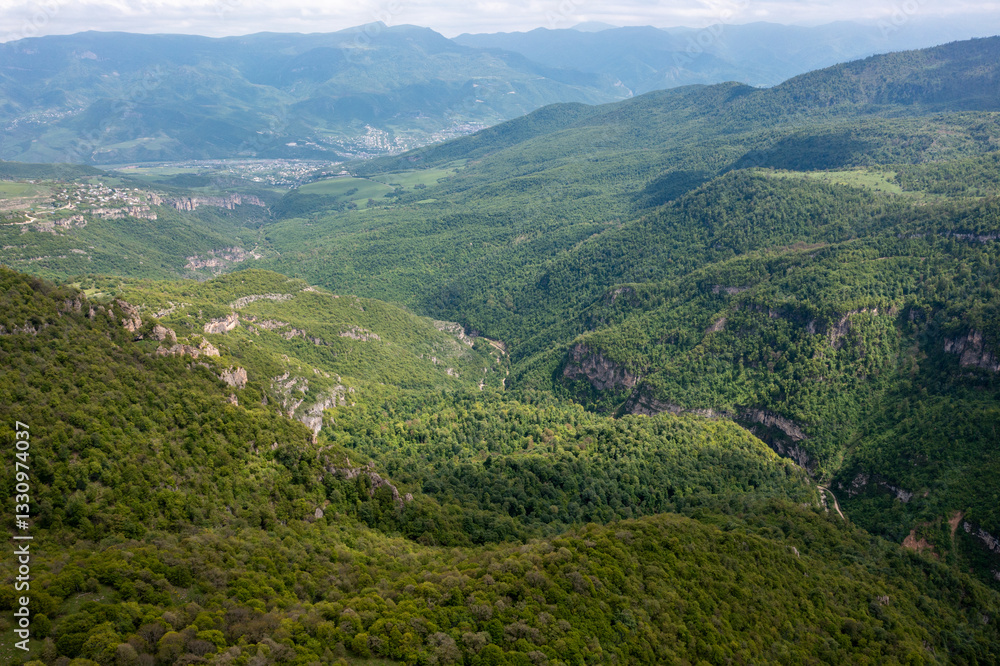 Aerial drone photo of Vorotan River Canyon near Tatev monastery stretched until Goris, the deepest canyon in Armenia, a popular travel and hiking destination with dramatic landscapes and lush greenery Aerial drone photo of Vorotan River Canyon near Tatev monastery stretched until Goris, the deepest canyon in Armenia, a popular travel and hiking destination with dramatic landscapes and lush greenery
