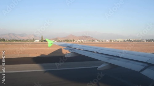 acceleration on an airport runway as seen from the window of a commercial airliner