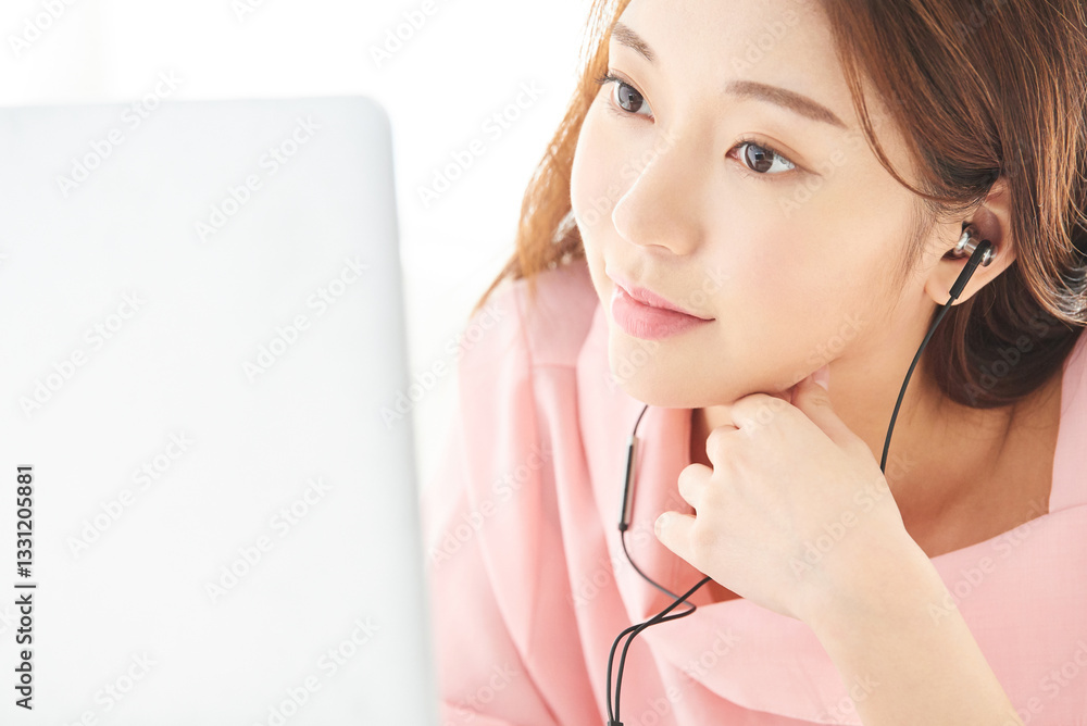 A young and beautiful woman is enjoying a pleasant holiday, lying on the bed in a sun-filled bedroom while using a laptop.
A young and beautiful woman is enjoying a pleasant holiday, lying on the bed in a sun-filled bedroom while using a laptop.