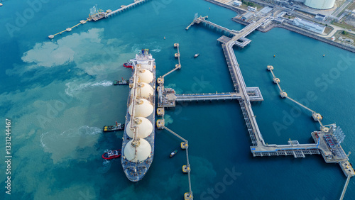 LNG (Liquified Natural Gas) tanker anchored in Gas terminal gas tanks for storage. Oil Crude Gas Tanker Ship. LPG at Tanker Bay Petroleum Chemical or Methane freighter export import transportation