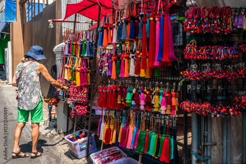 Obraz na płótnie Woman shopping for souvenirs in Chiang Mai, Thailand w salonie