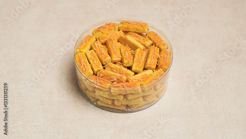 Kastengel cake is a savory cheese cake or cheese stick that originates from the Netherlands. This cake is popular for celebrations such as Eid al-Fitr. kastengel in a jar