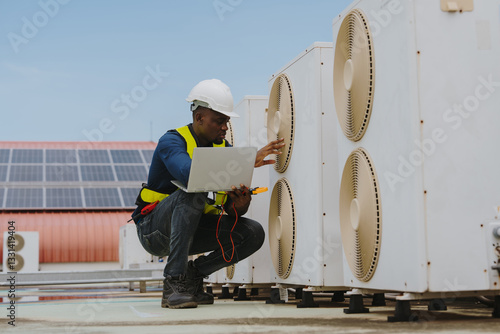 Engineers are checking the air conditioning and cooling system in a commercial building.(PHOTO)
