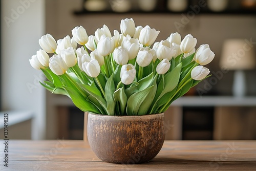 White Tulips Arranged in a Decorative Pot on a Wooden Table in a Bright Room