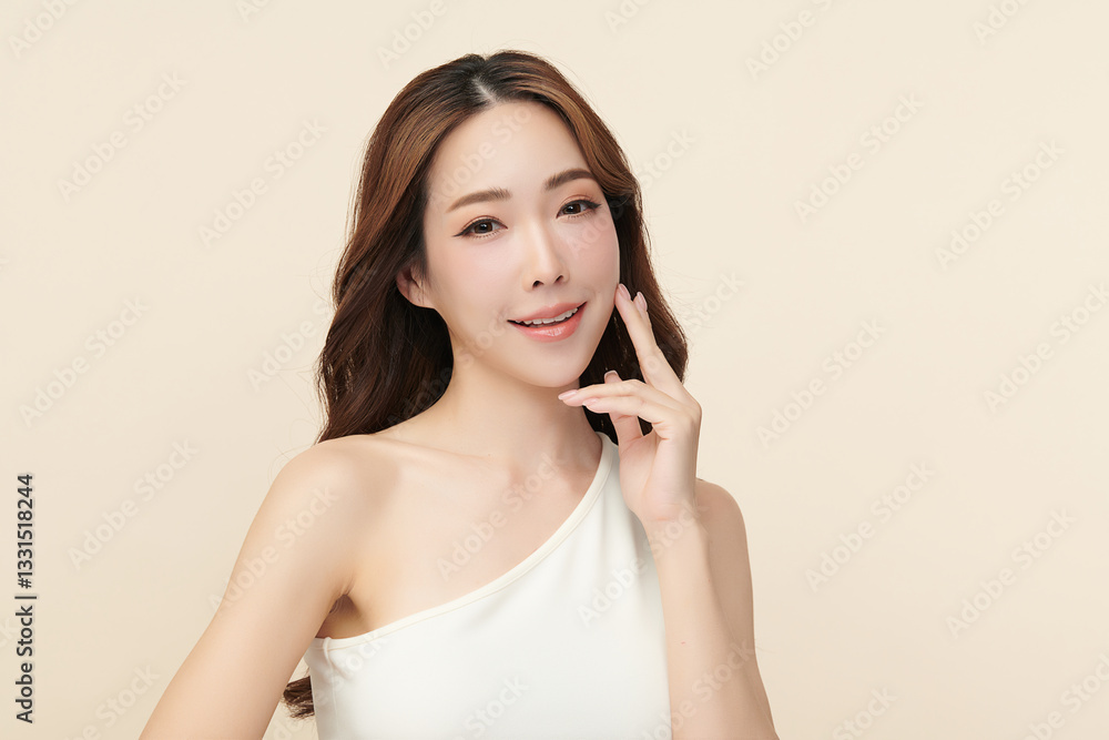 A beautiful young Asian woman with clean, fresh skin against a beige background. She represents beauty, skincare, and spa treatments. A beautiful young Asian woman with clean, fresh skin against a beige background. She represents beauty, skincare, and spa treatments.