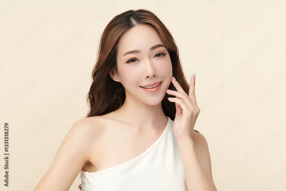 A beautiful young Asian woman with clean, fresh skin against a beige background. She represents beauty, skincare, and spa treatments. A beautiful young Asian woman with clean, fresh skin against a beige background. She represents beauty, skincare, and spa treatments.