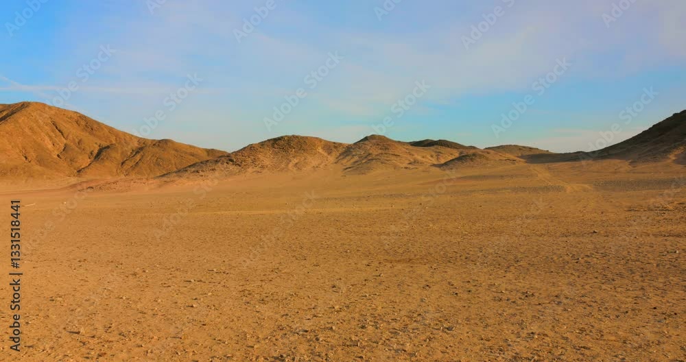 Golden sands stretch endlessly in the Egyptian desert, framed by gentle hills under a vibrant blue sky. The vastness of the landscape evokes feelings of tranquility and wonder. Golden sands stretch endlessly in the Egyptian desert, framed by gentle hills under a vibrant blue sky. The vastness of the landscape evokes feelings of tranquility and wonder.