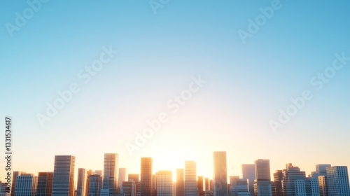 City skyline at sunrise. Buildings line the horizon under a clear blue sky