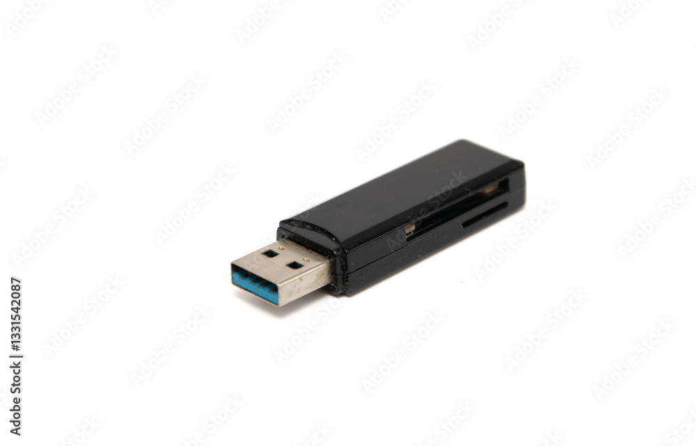 A black USB flash drive sits on a white background A black USB flash drive sits on a white background