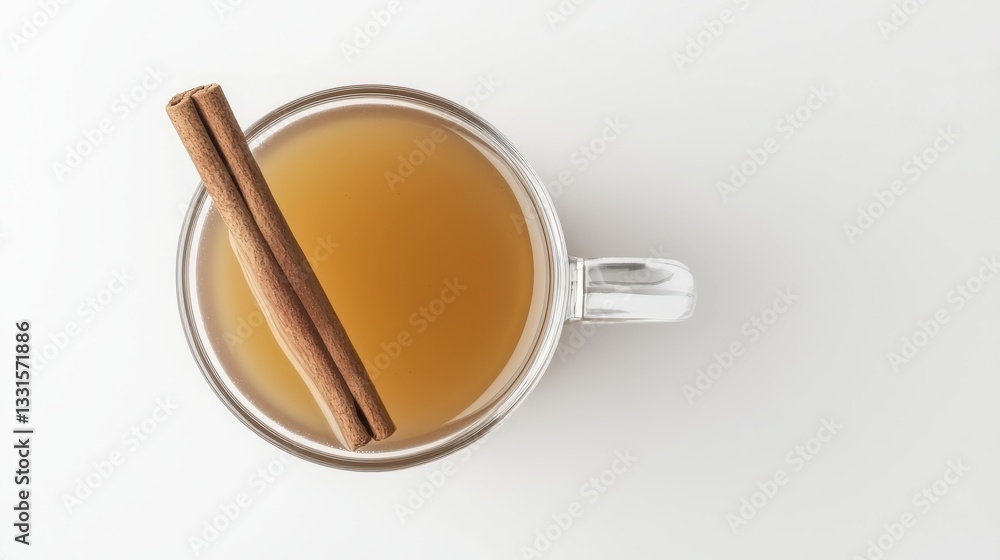 Warm Spiced Drink with Cinnamon Sticks in Clear Glass Cup Warm Spiced Drink with Cinnamon Sticks in Clear Glass Cup
