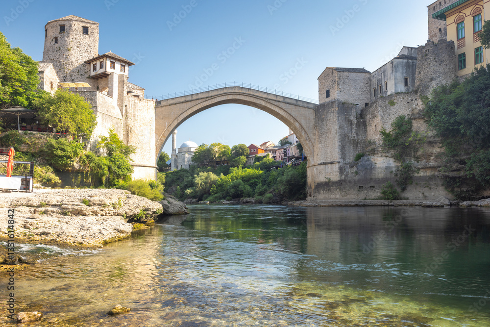 The Stari Most bridge, old bridge on Neretva river in Mostar town, Bosnia and Herzegovina, Europe. Iconic stone bridge arching over a river, blending history and architecture with natural beauty. The Stari Most bridge, old bridge on Neretva river in Mostar town, Bosnia and Herzegovina, Europe. Iconic stone bridge arching over a river, blending history and architecture with natural beauty.