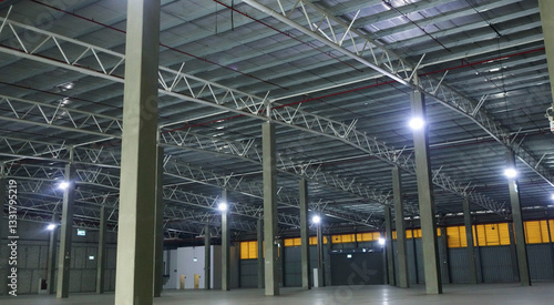 an empty industrial warehouse with large, clean windows, atmospheric light, white.