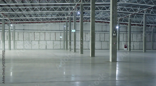 an empty industrial warehouse with large, clean windows, atmospheric light, white.