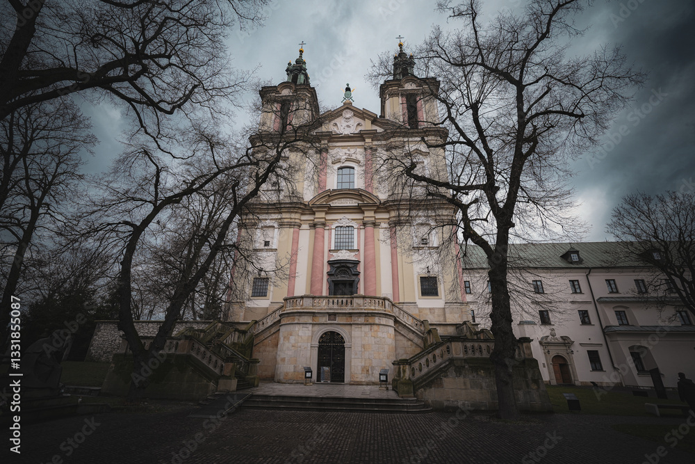 Obraz premium The Basilica of St. Michael the Archangel, also known as the Church on Skałka, is a historic Baroque-style church located in Kraków, Poland. The basilica, managed by the Pauline Fathers, 