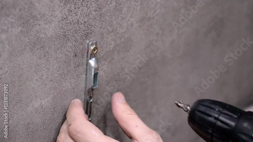 Wallpaper Mural Professional construction worker carefully mounting metal bracket on concrete wall, using cordless drill while preparing to install furniture in interior space Torontodigital.ca