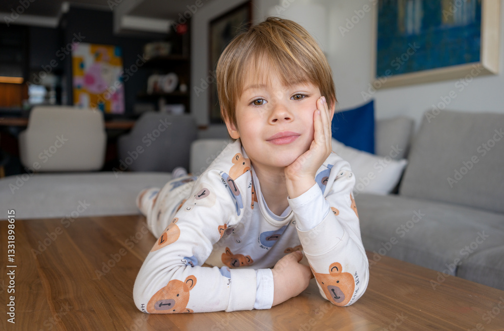 Little boy portrait looking at camera at home. Little boy portrait looking at camera at home.