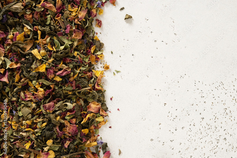 Dry herbal tea and green tea as frame on white background. View from above. Copy space. Dry tea leaves texture.