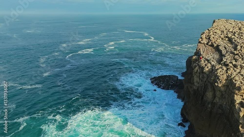 Solitary Climb: A Lone Climbers Journey Along a Coastal Cliff