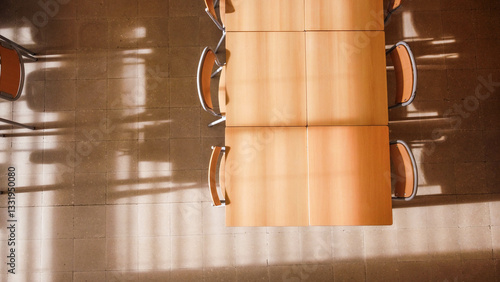 Aerial view of a school classroom, with brown chairs and tables
