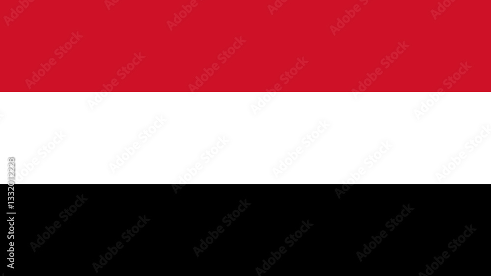 Naklejka premium National flag of Yemen proudly displayed under a clear blue sky in a vibrant urban setting