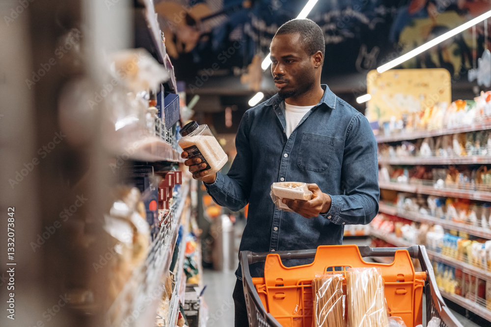 Man customer is in the supermarket Man customer is in the supermarket