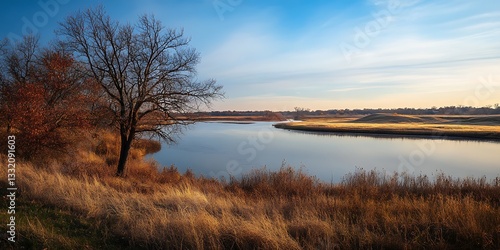 a body of water with trees and a sunset