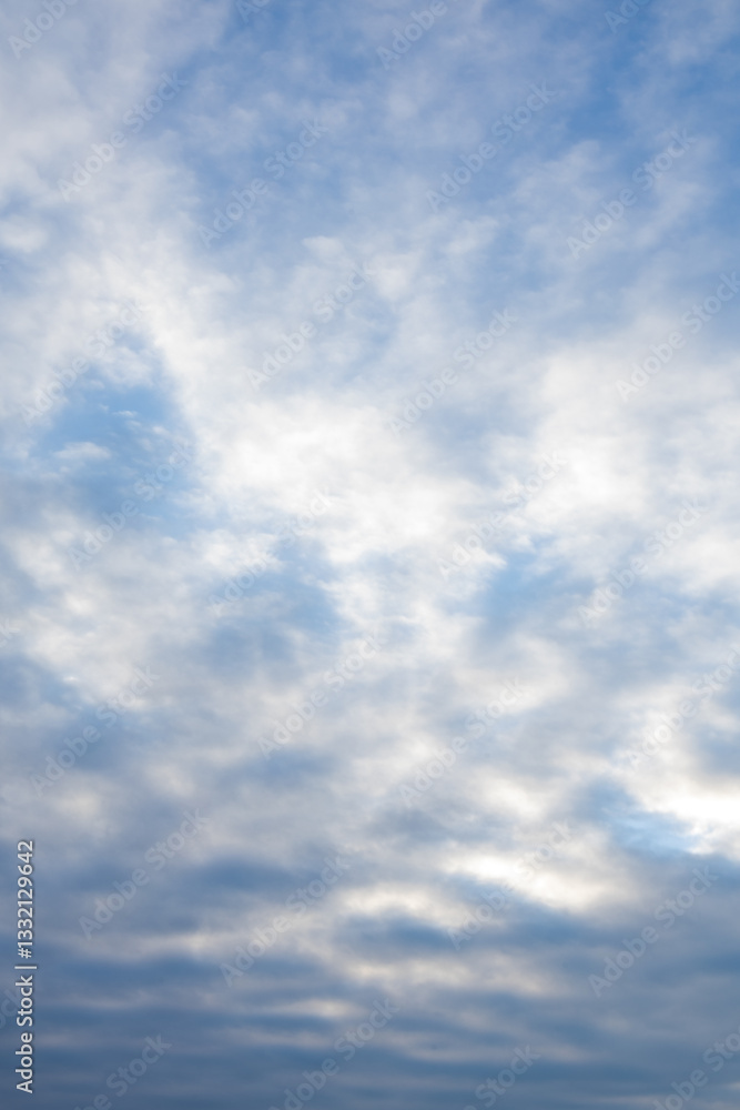 soft blue sky with textured clouds at dawn soft blue sky with textured clouds at dawn
