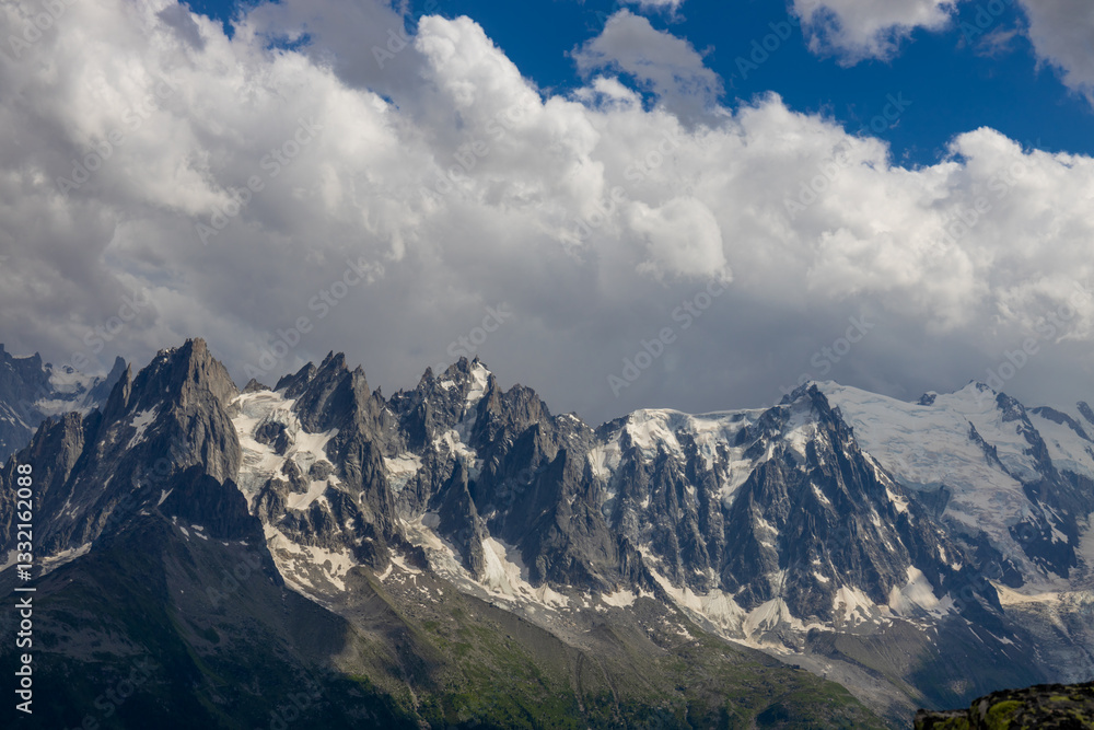 Fototapeta premium Aiguilles de Chamonix rocky granite mountain peaks in french Alps around Mont Blanc summit in Chamonix valley. Scenic landscape of iconic alpine summits the legends of mountaineering and alpinism