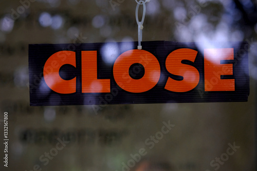 closed signboard on a door at coffee shop.