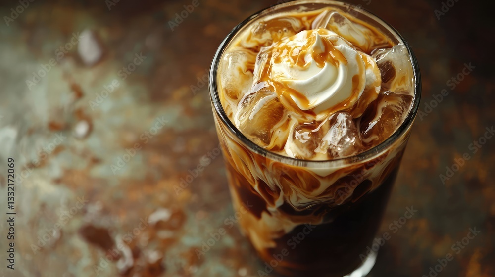 A freshly blended iced coffee with cream swirling inside A freshly blended iced coffee with cream swirling inside