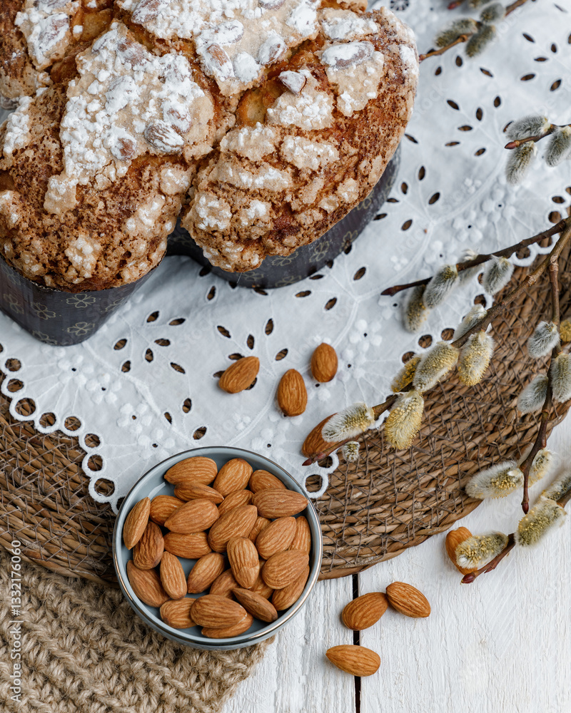 Fototapeta premium Colomba - Italian traditional Easter bread is topped with pearl sugar and almonds in the shape of a dove. Festive pastries are traditional in Italy.