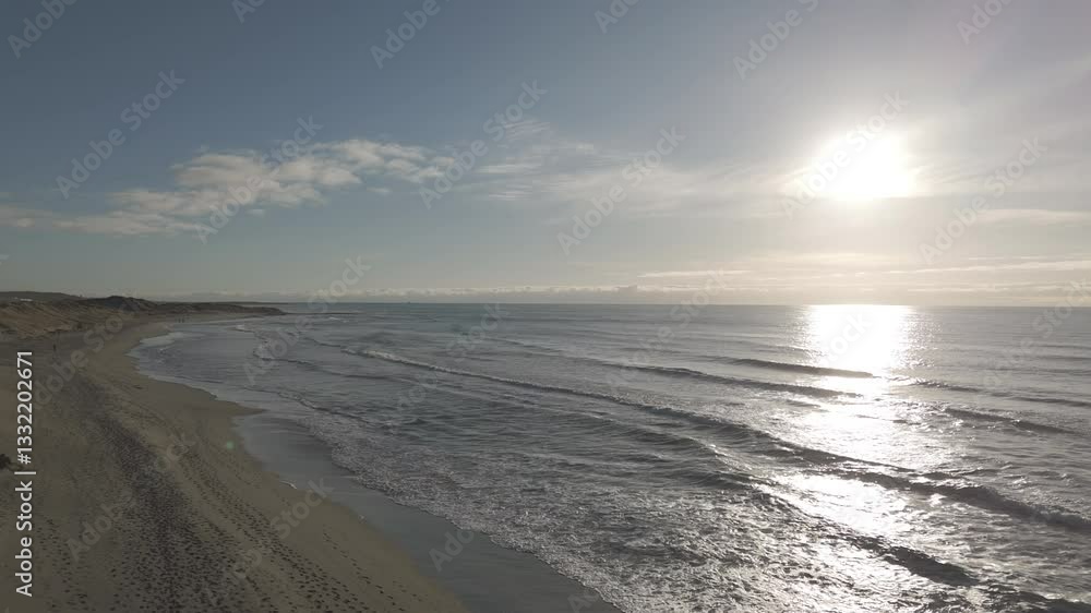 Backwards flying drone shot over the dunes near Borestranda Norway during sunset going away from the beach and sea and flying upwards for an overview shot LOG Backwards flying drone shot over the dunes near Borestranda Norway during sunset going away from the beach and sea and flying upwards for an overview shot LOG