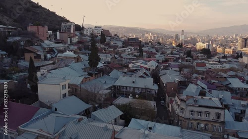 Scenic drone flight over Old Tbilisi during sunset. Popular tourist destination for its historic architecture.