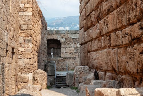 View of the stone walls of the old ancient crusader castle in the historic city of Byblos. The city is a UNESCO World Heritage Site. Lebanon.