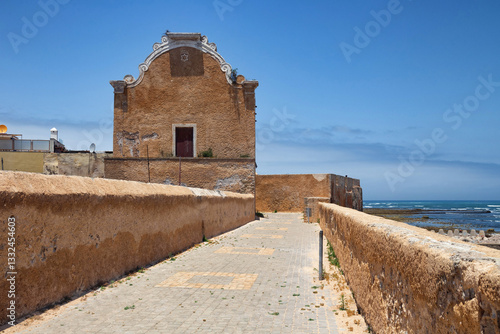 View of the historic walls of the fortress of El Jadida (Mazagan). The fortified city, built by the Portuguese at the beginning of the 16th century and named Mazagan. Morocco, Africa.
