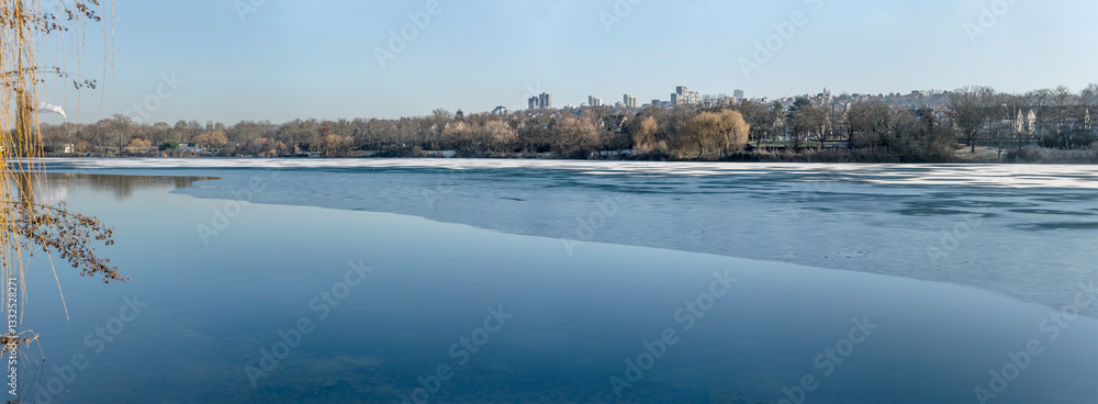 south-eastern shore of frozen Max-Eyth-See lake, Stuttgart, Germany