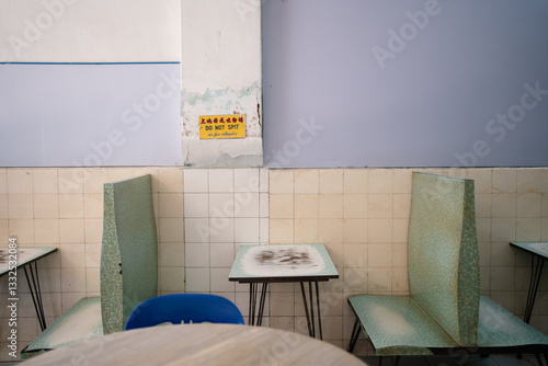 Traditional hong kong style coffee shop (cha chaan teng) table and back-to-back chairs.
